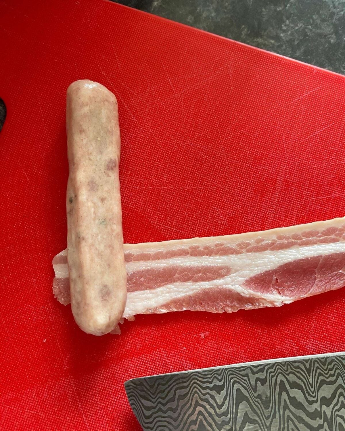 wrapping sausages in bacon
