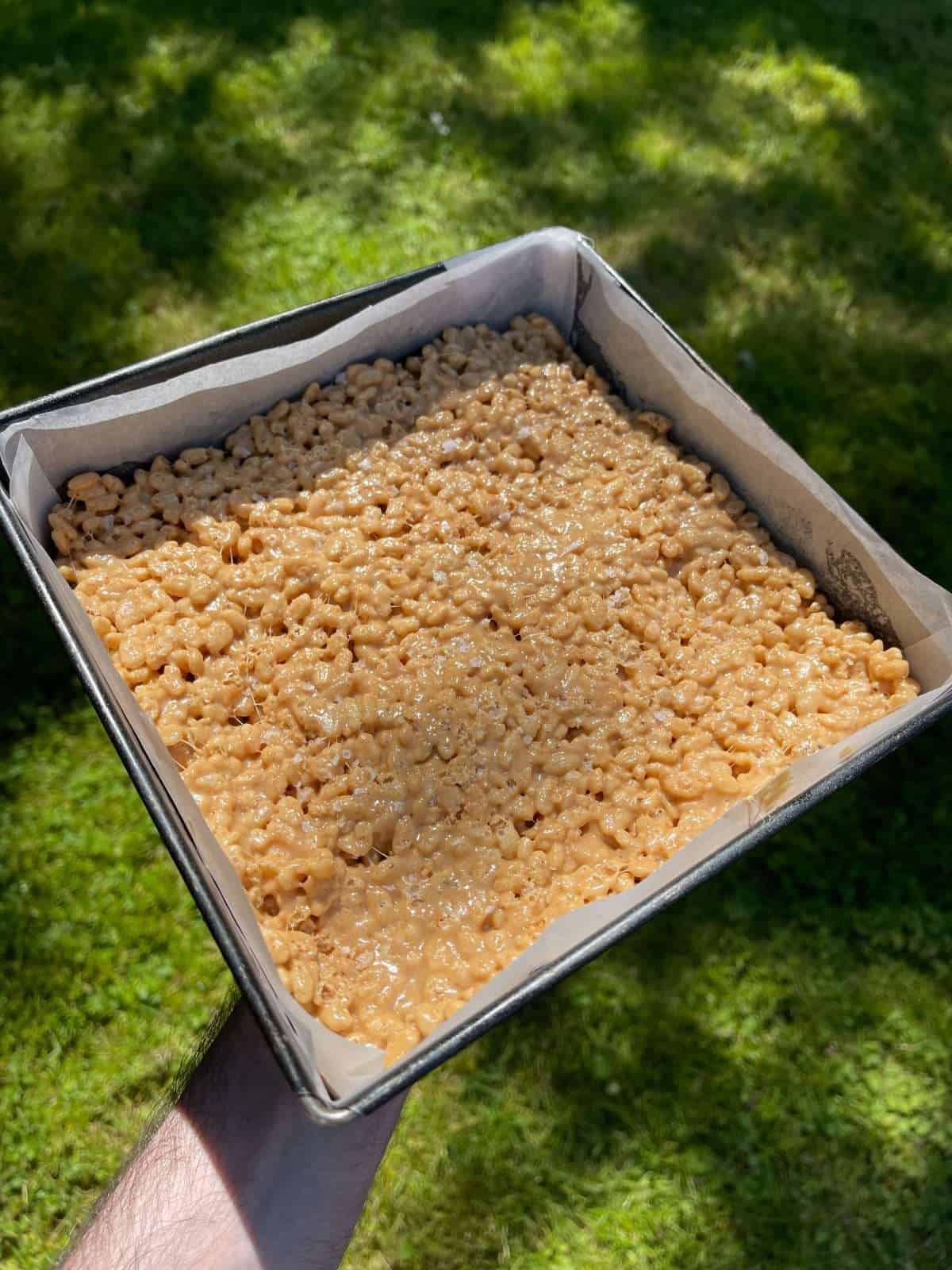 rice krispie treats setting in a tin