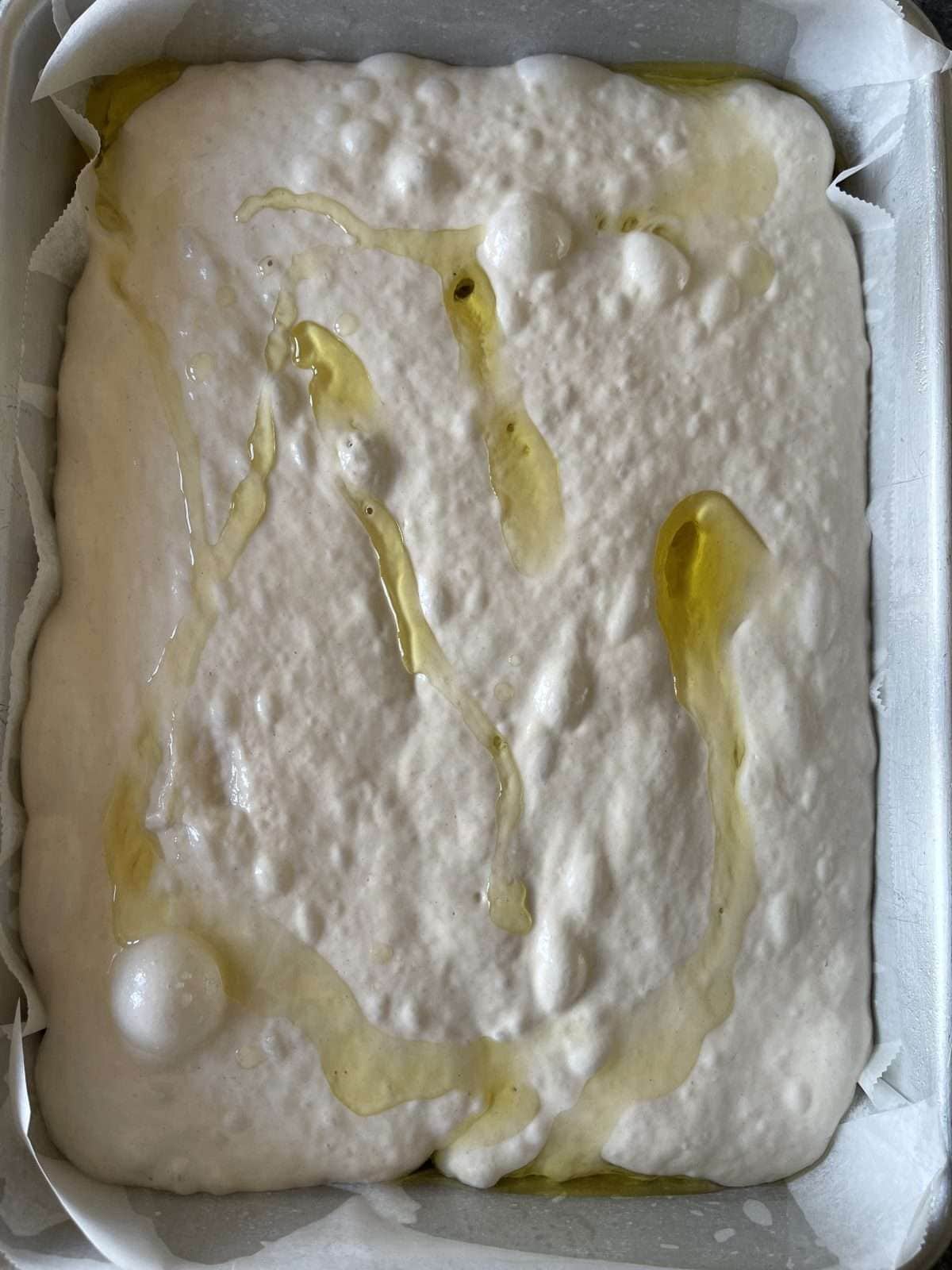 olive oil drizzle on top of focaccia