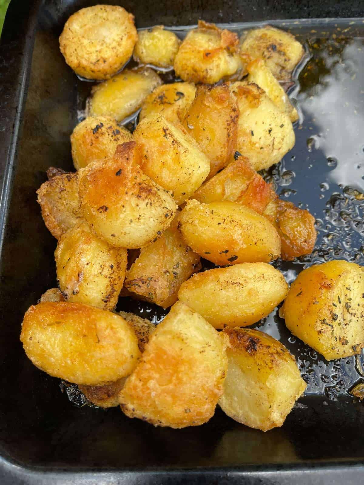 black garlic roast potatoes in tray
