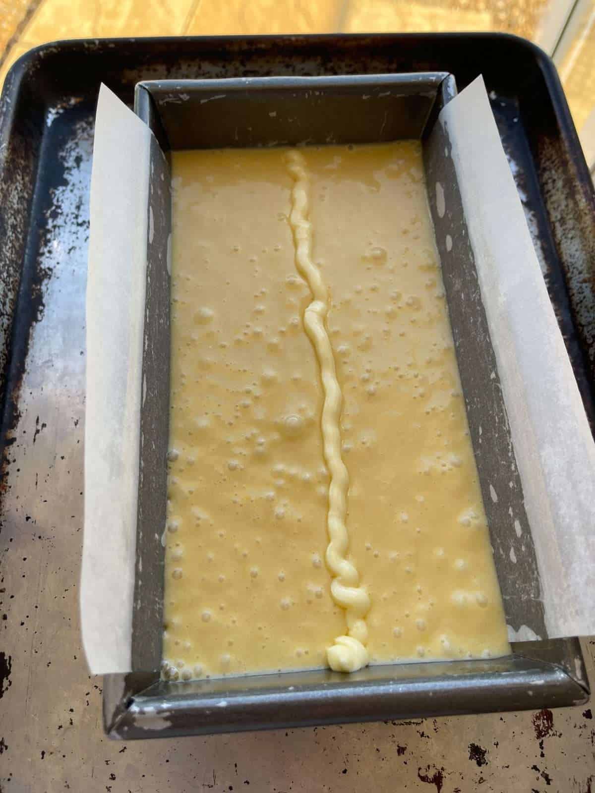 line of butter piped down middle of cake