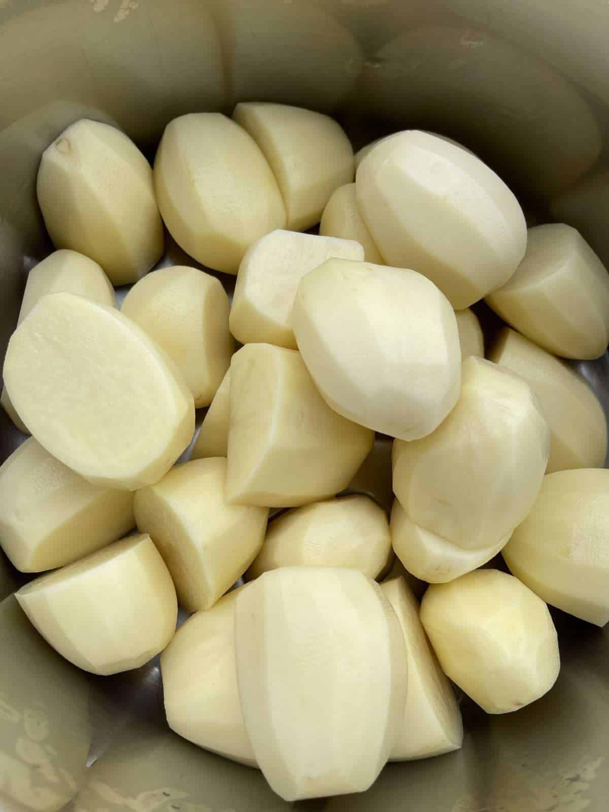 potatoes cut for roasties