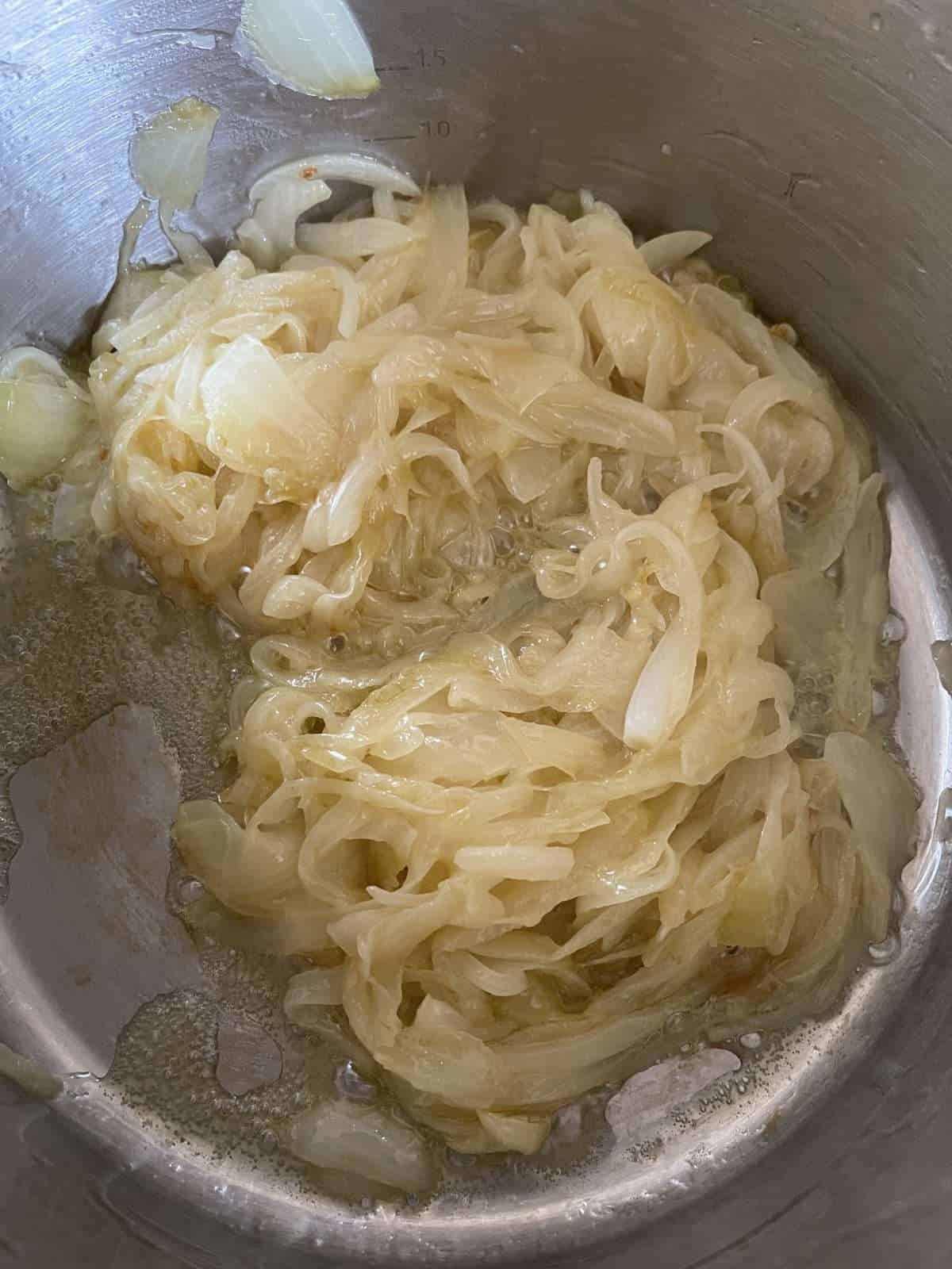 sliced onions cooking in butter