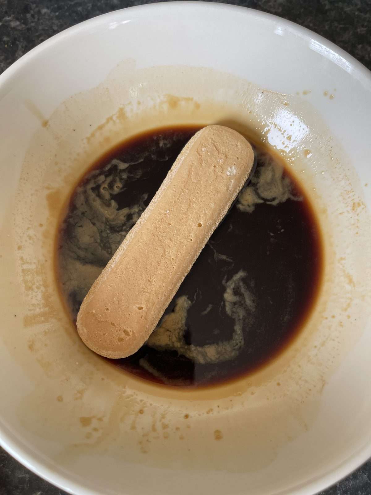 soaking lady finger in coffee