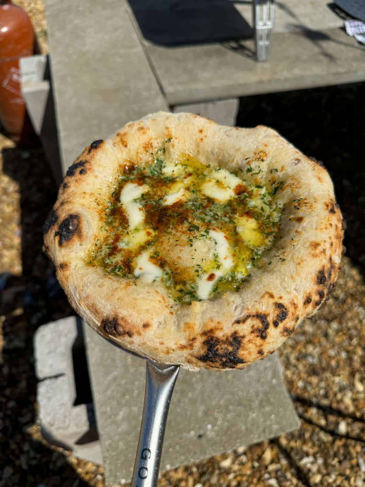 garlic bread cooked in a pizza oven