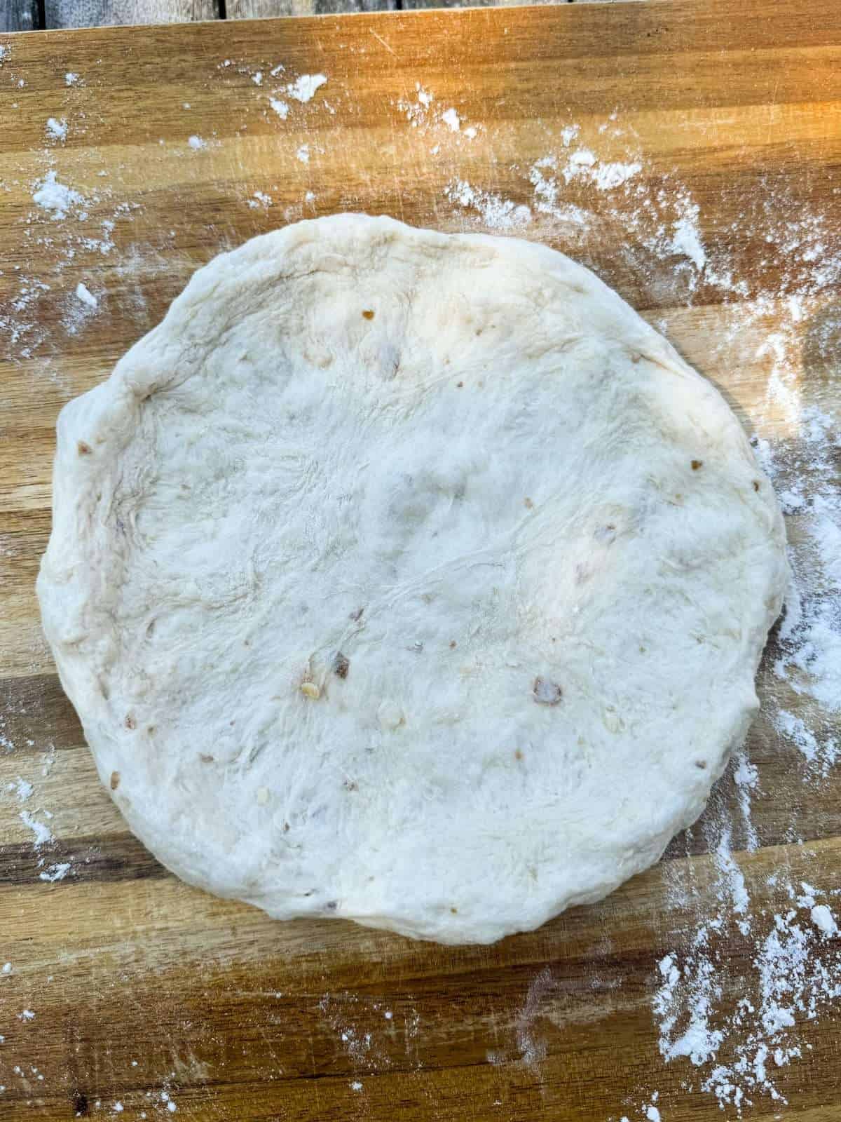 opened up pizza dough ready for toppings
