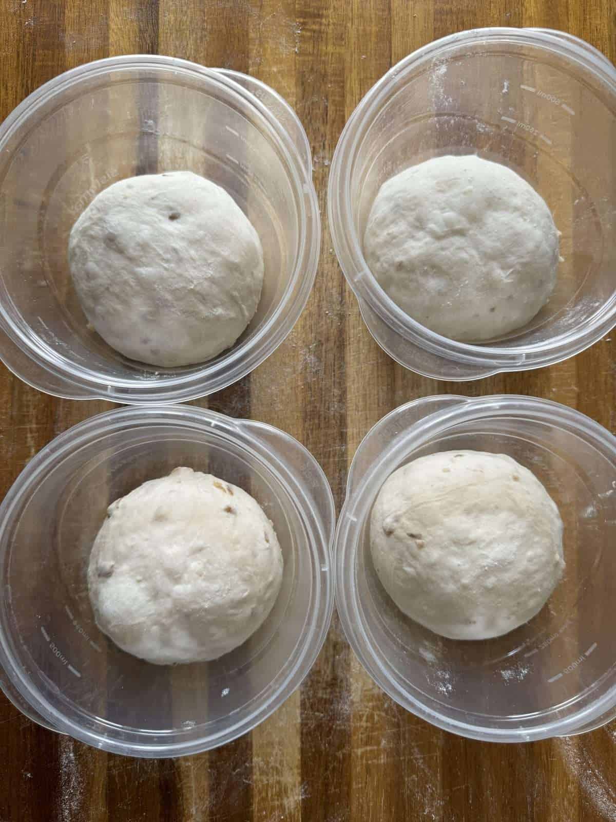 shaped pizza dough in pots