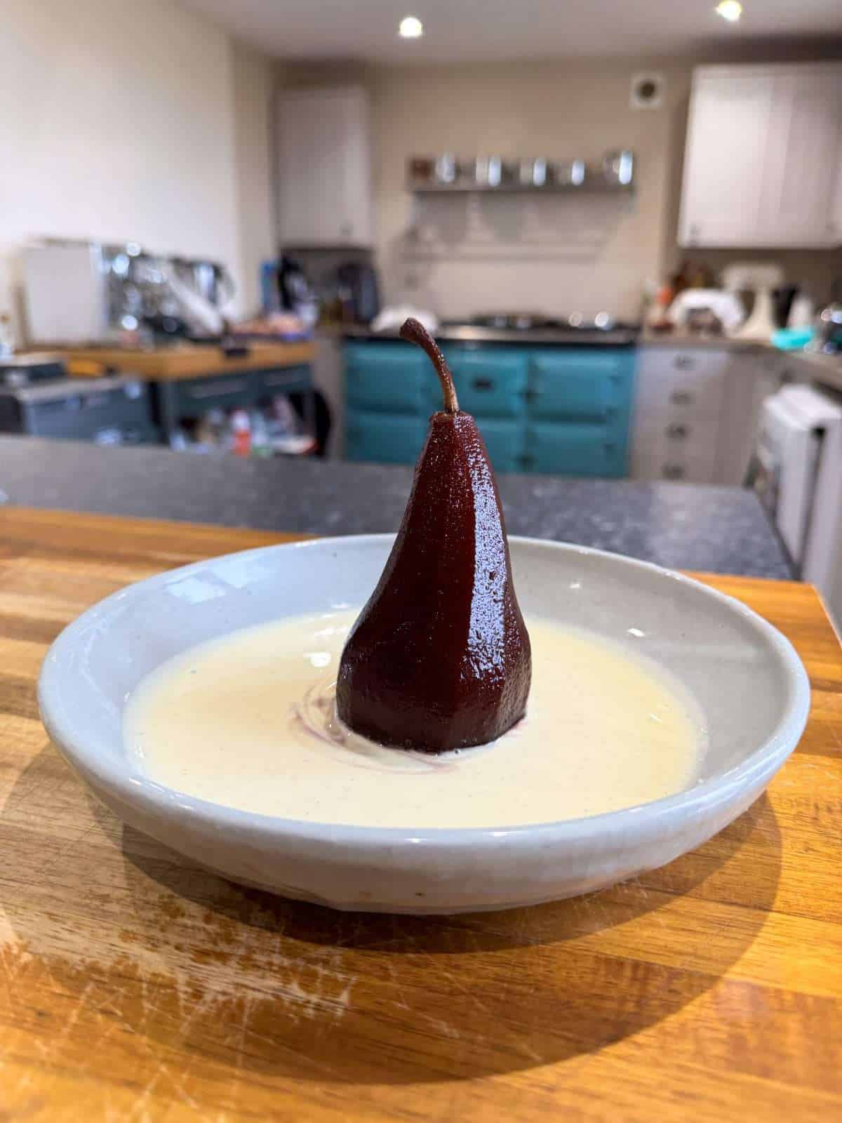 poached pear served with creme anglaise