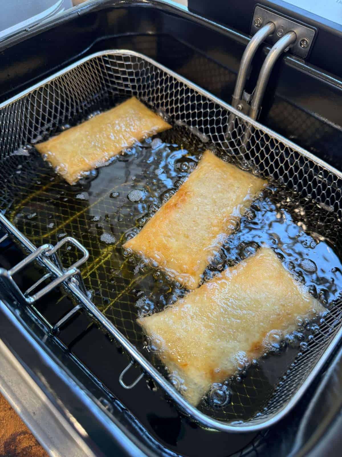 mince pies cooking in deep fat fryer