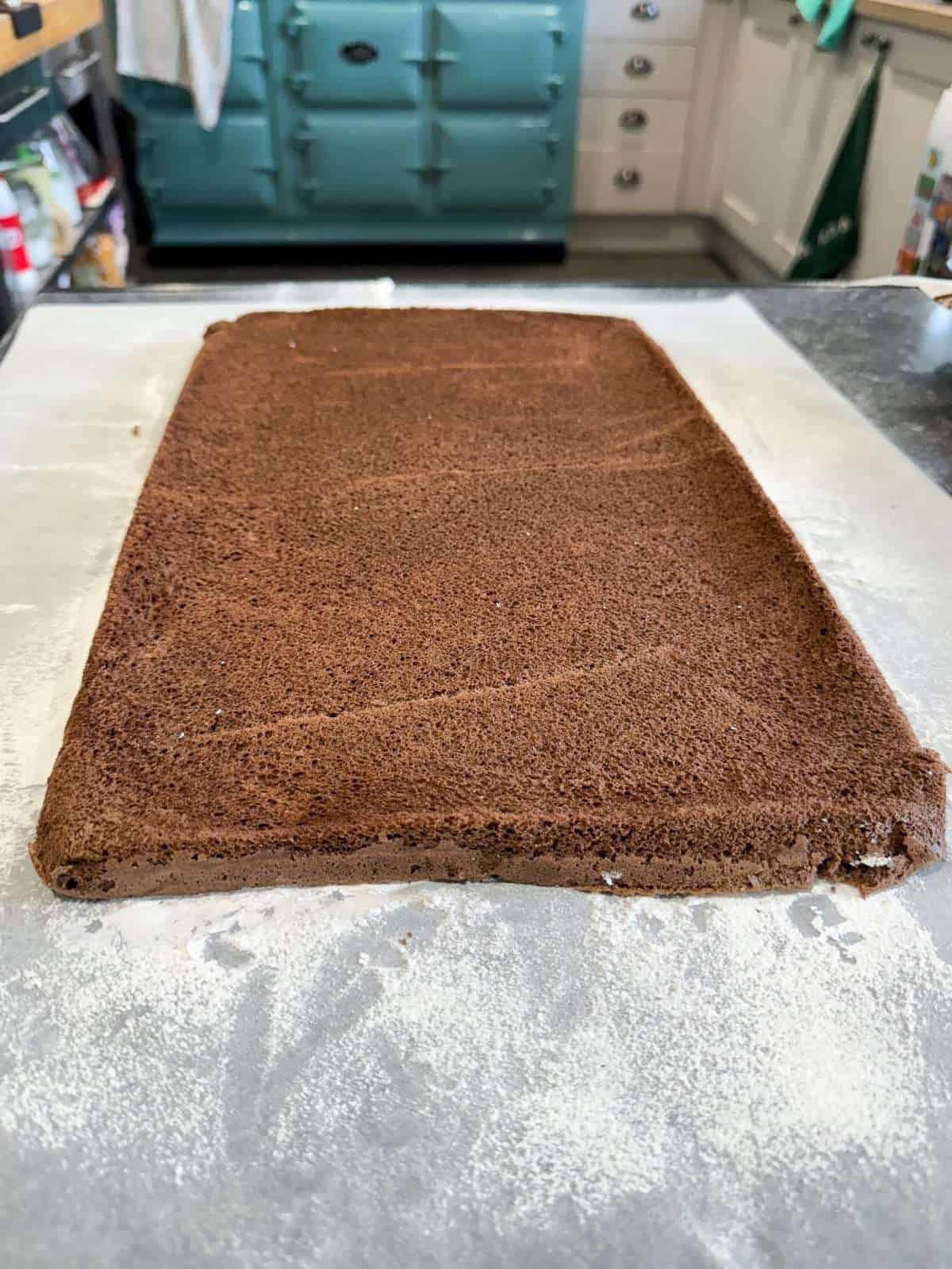 parchment dusted with icing sugar to stop cake sticking
