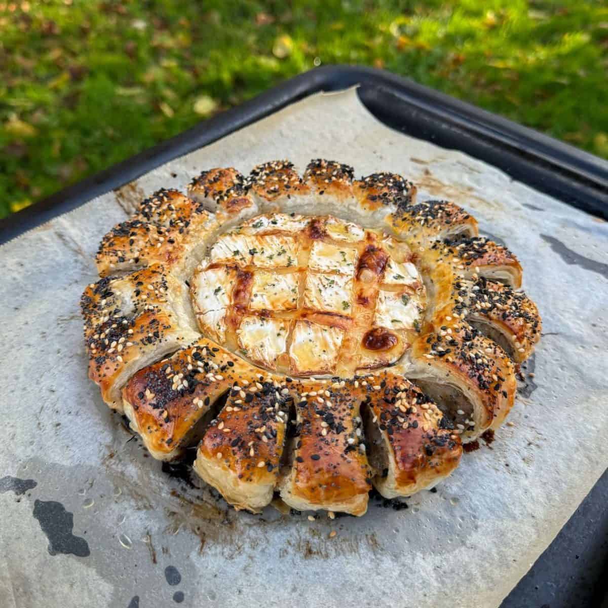 sausage roll wreath with honey glazed camembert
