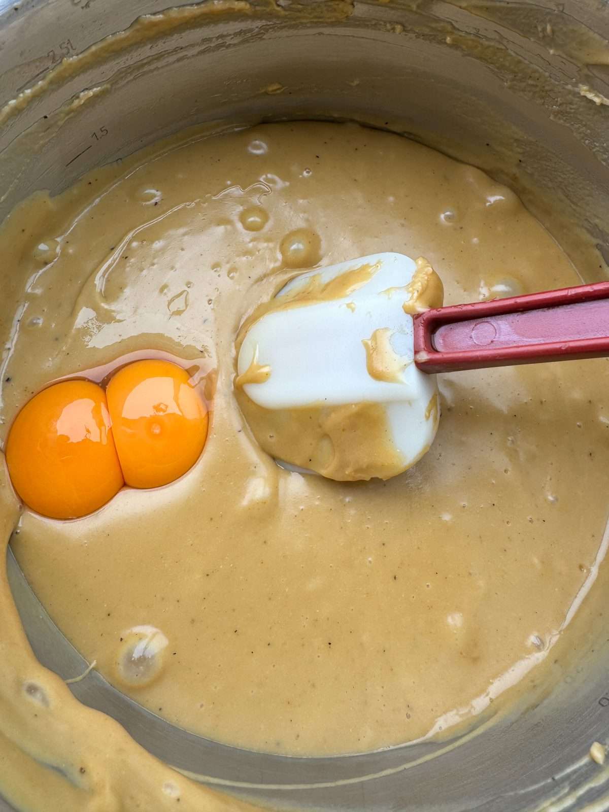 adding egg yolks to rarebit
