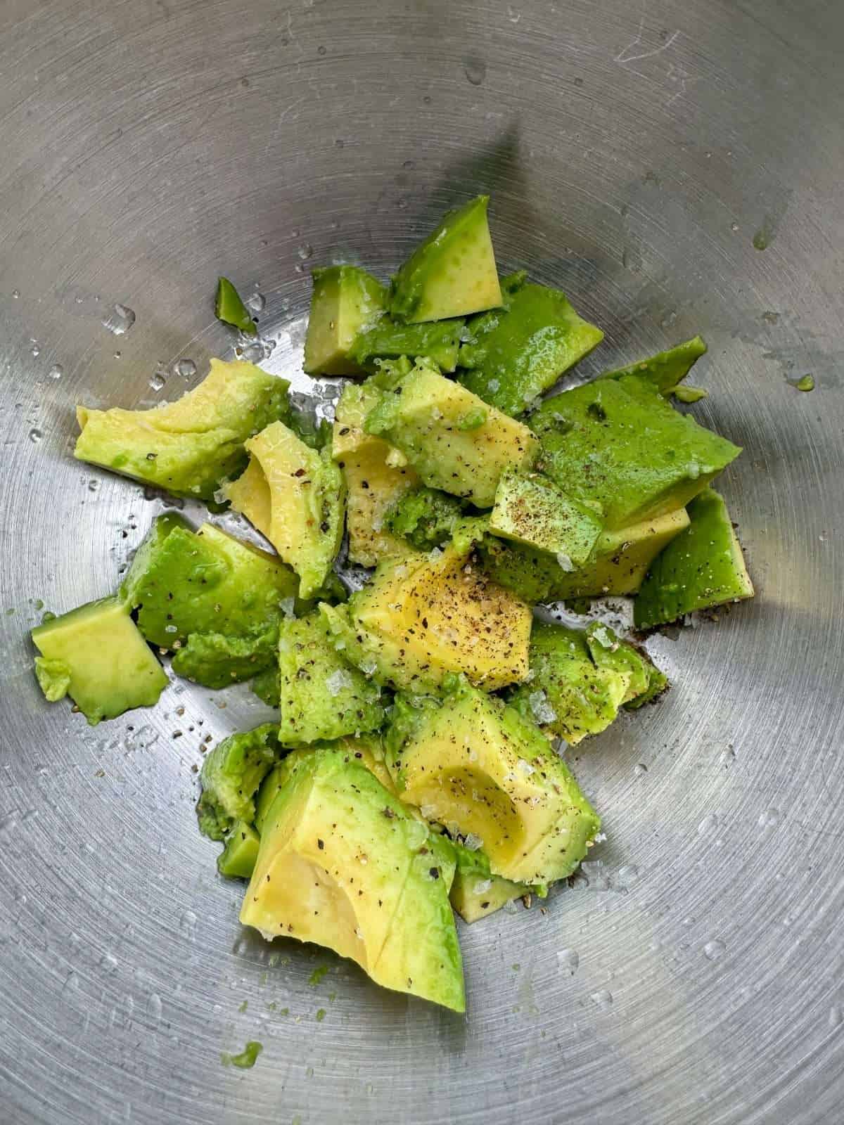scooped out avocado flesh with lime juice
