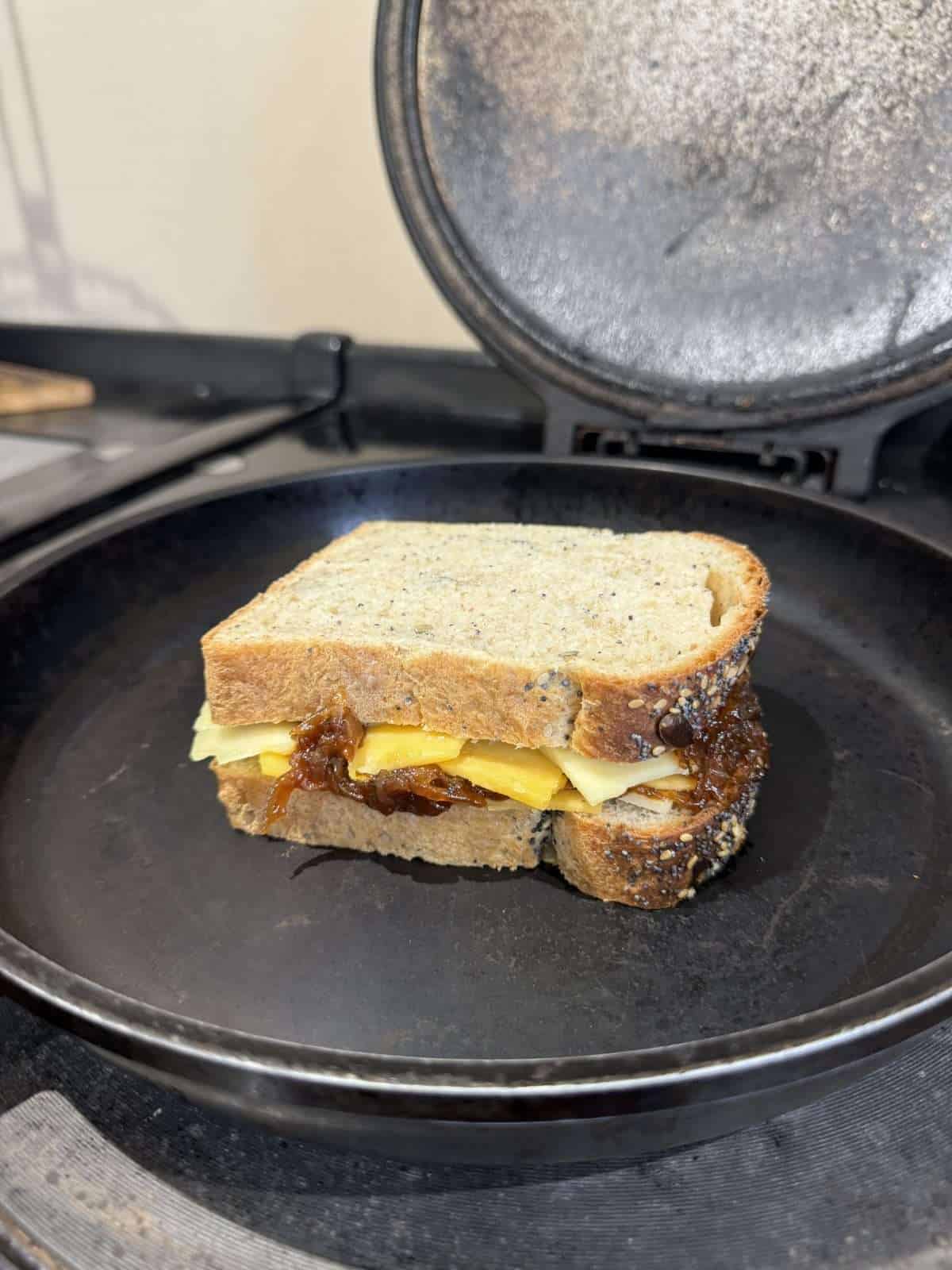 cheese toastie cooking in frying pan