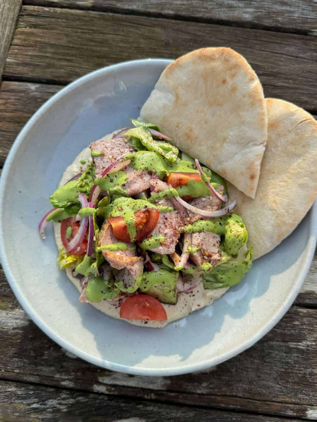 hummus with lamb salad and green tahini