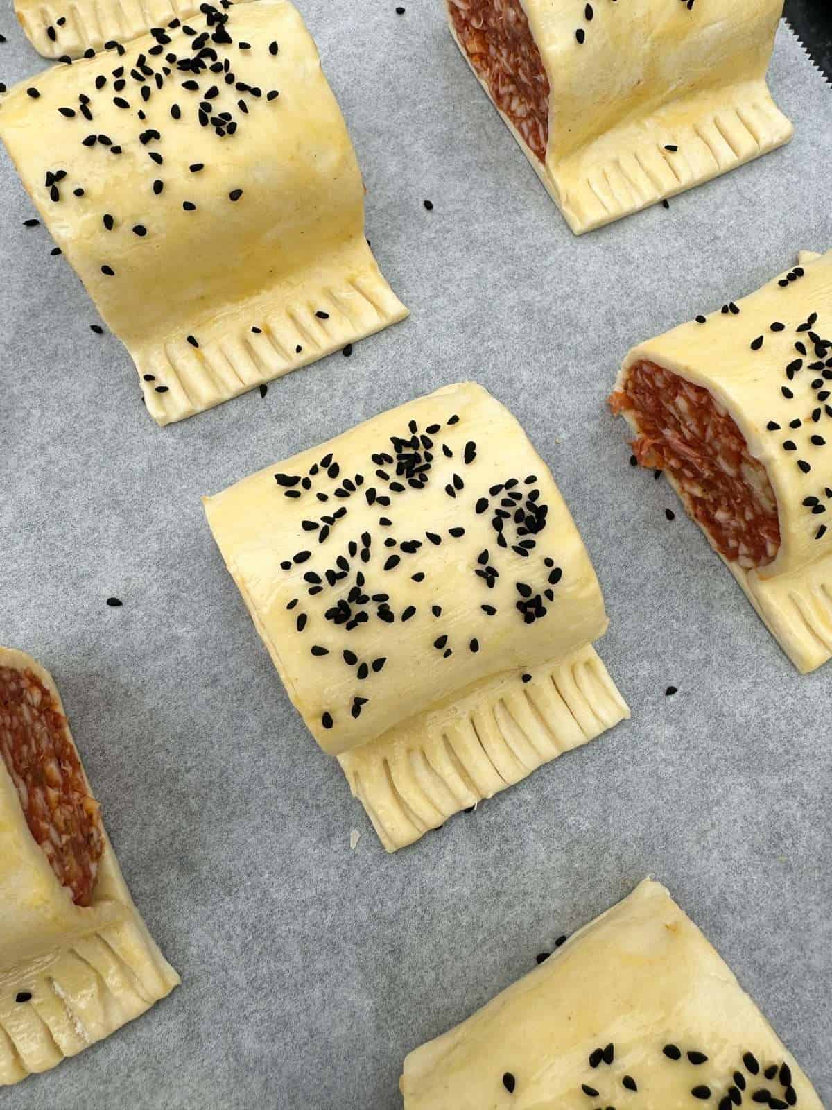 sausage rolls egg washed & sprinkled with nigella seeds