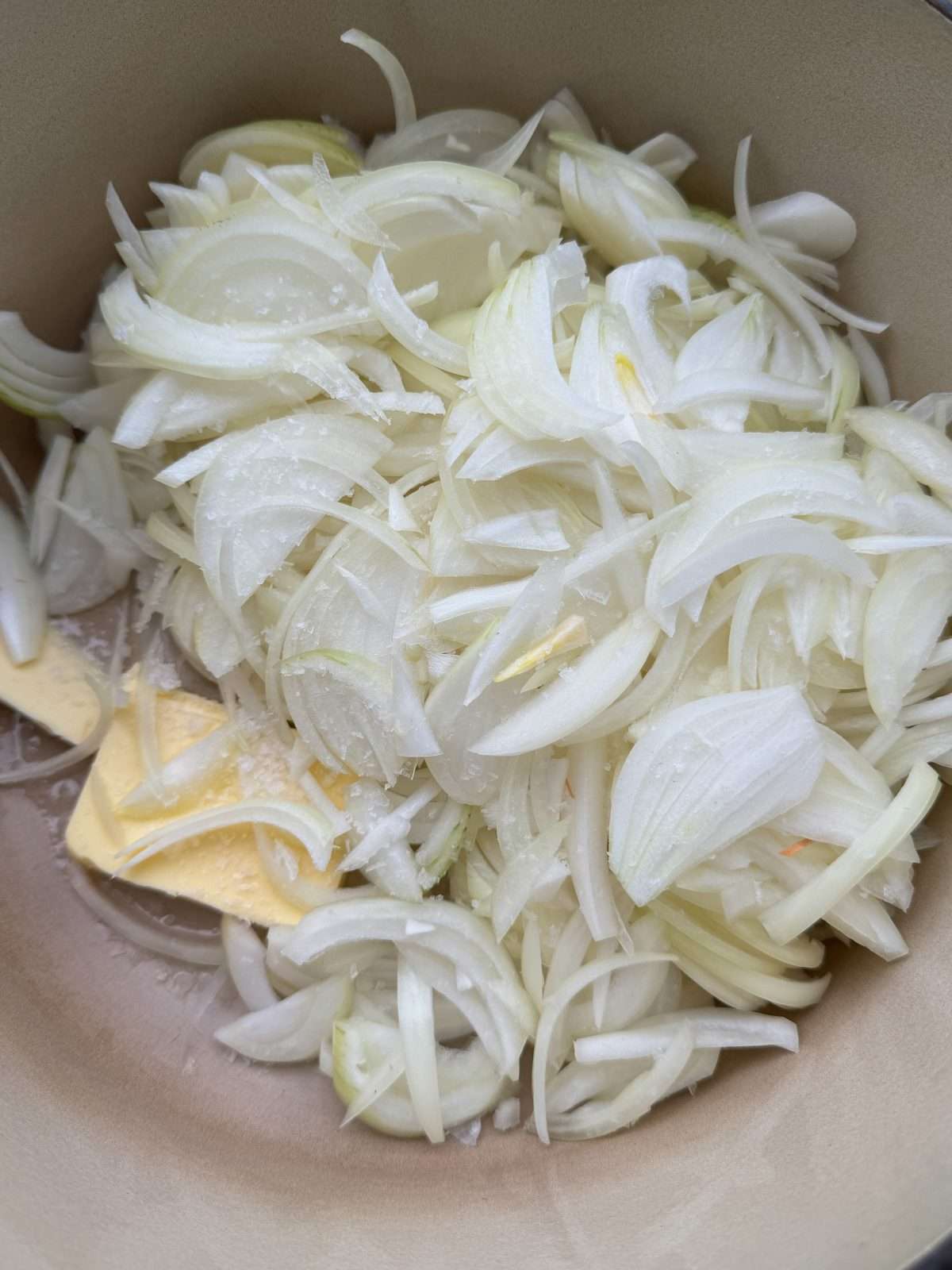 sliced onions cooking in butter