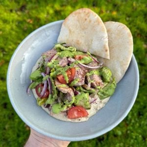 za'atar lamb salad with hummus and tahini dressing