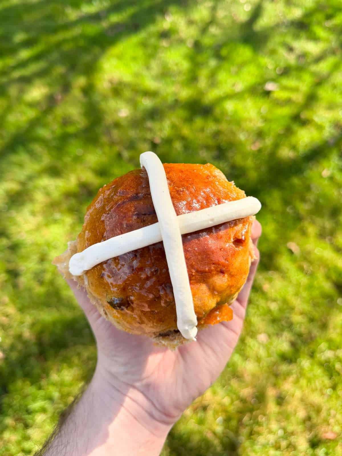 carrot cake hot cross bun with cream cheese frosting