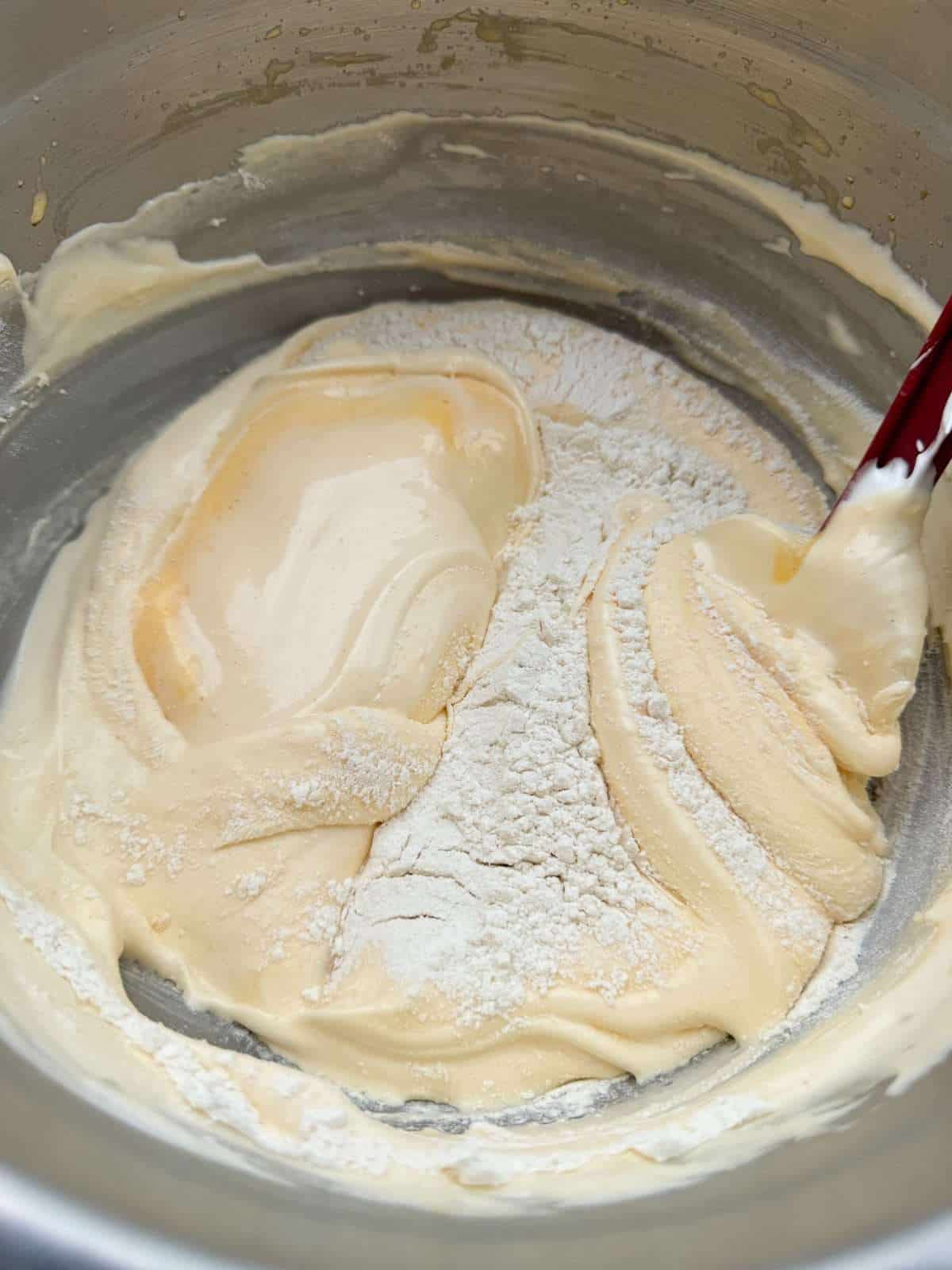 folding flour into eggs