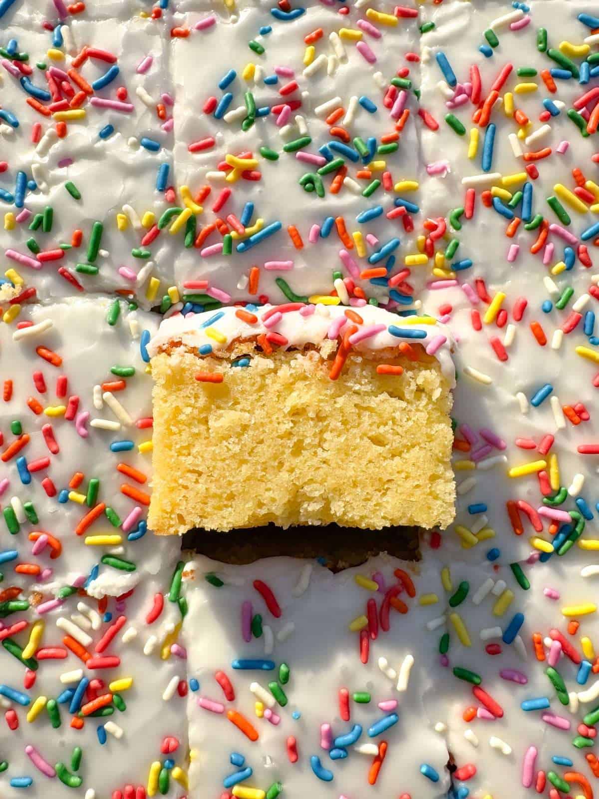 vanilla sponge cake with icing & sprinkles