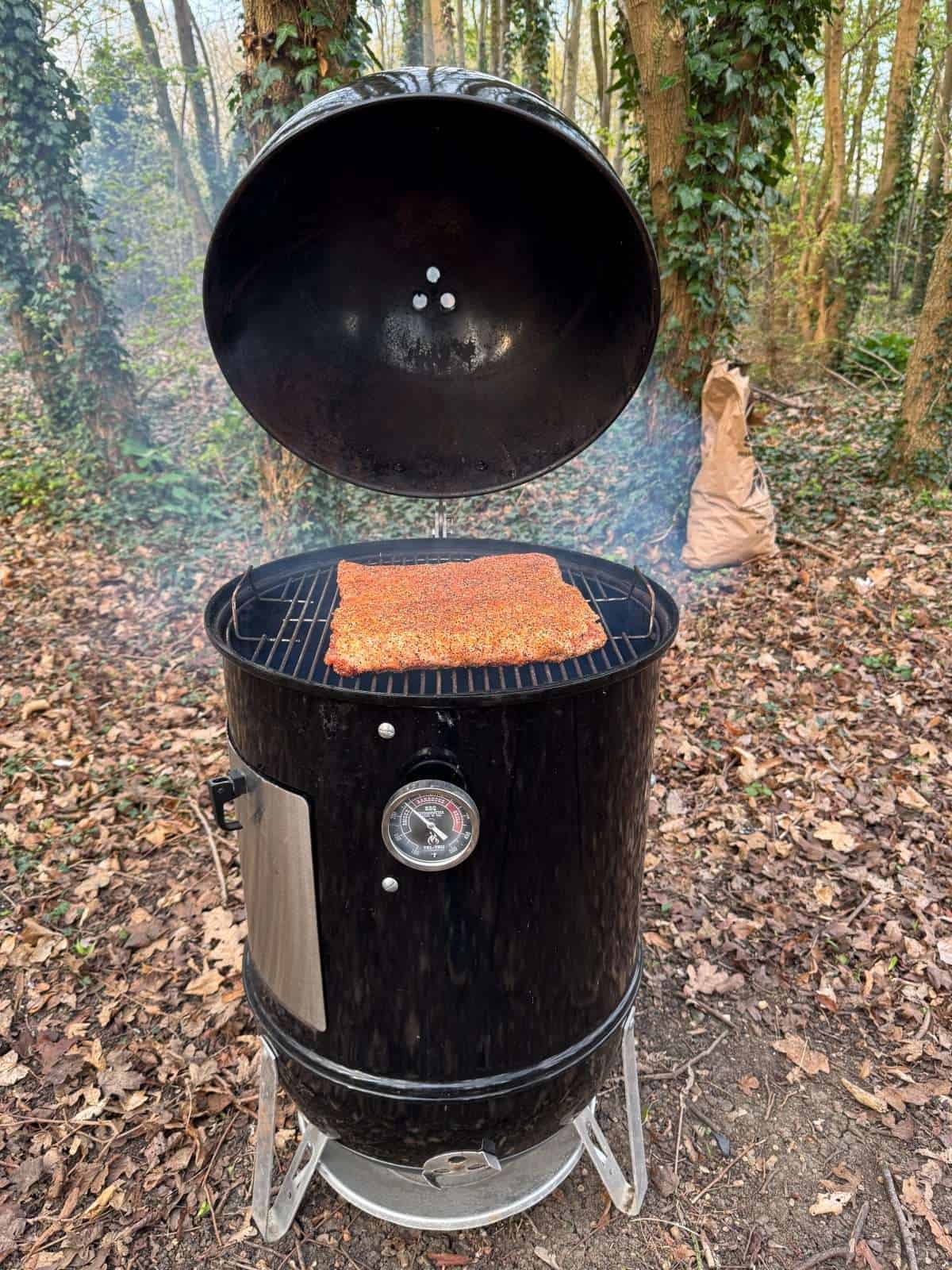 smoker with pork belly in