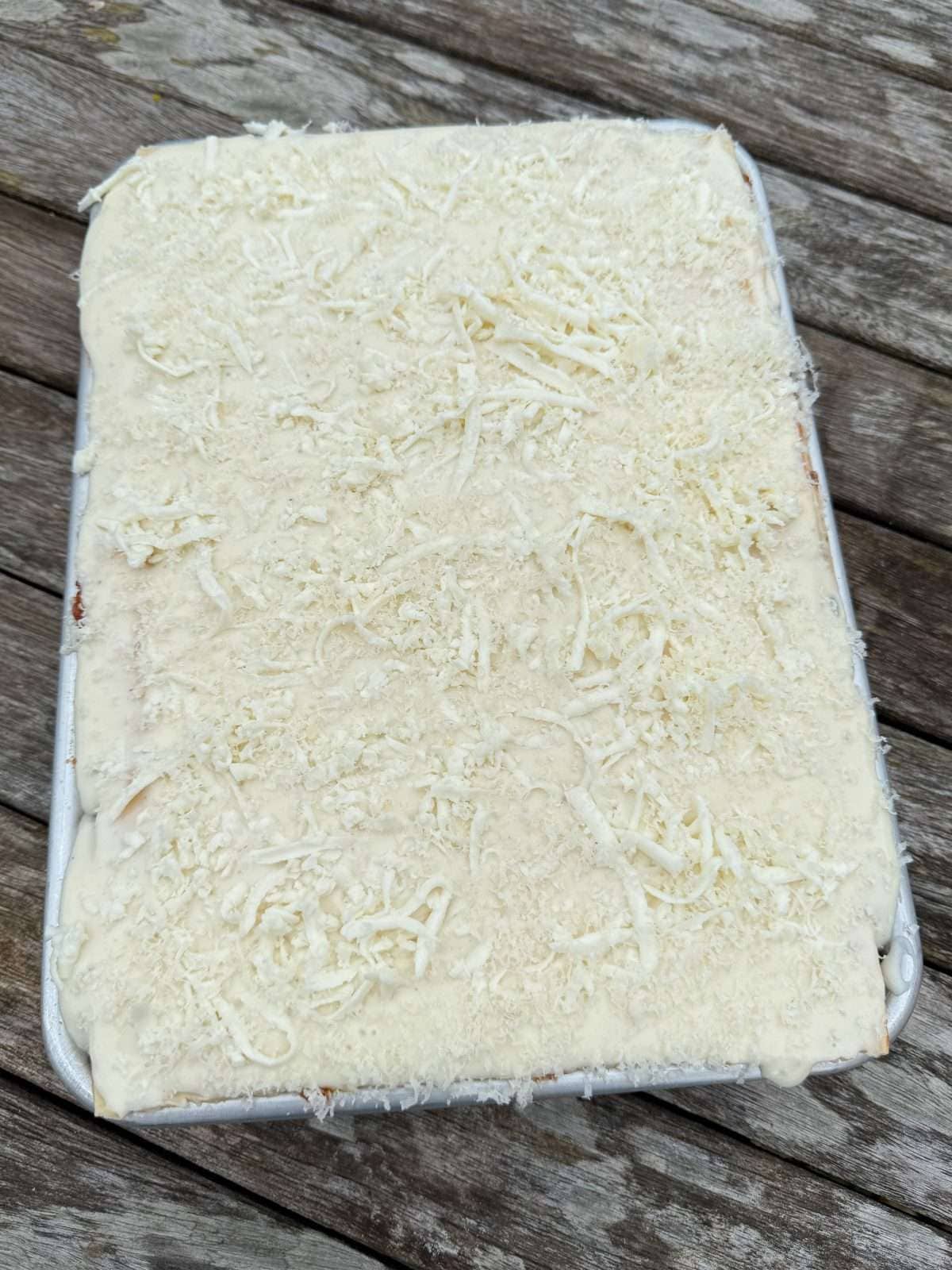 assembled lasagne in baking tin