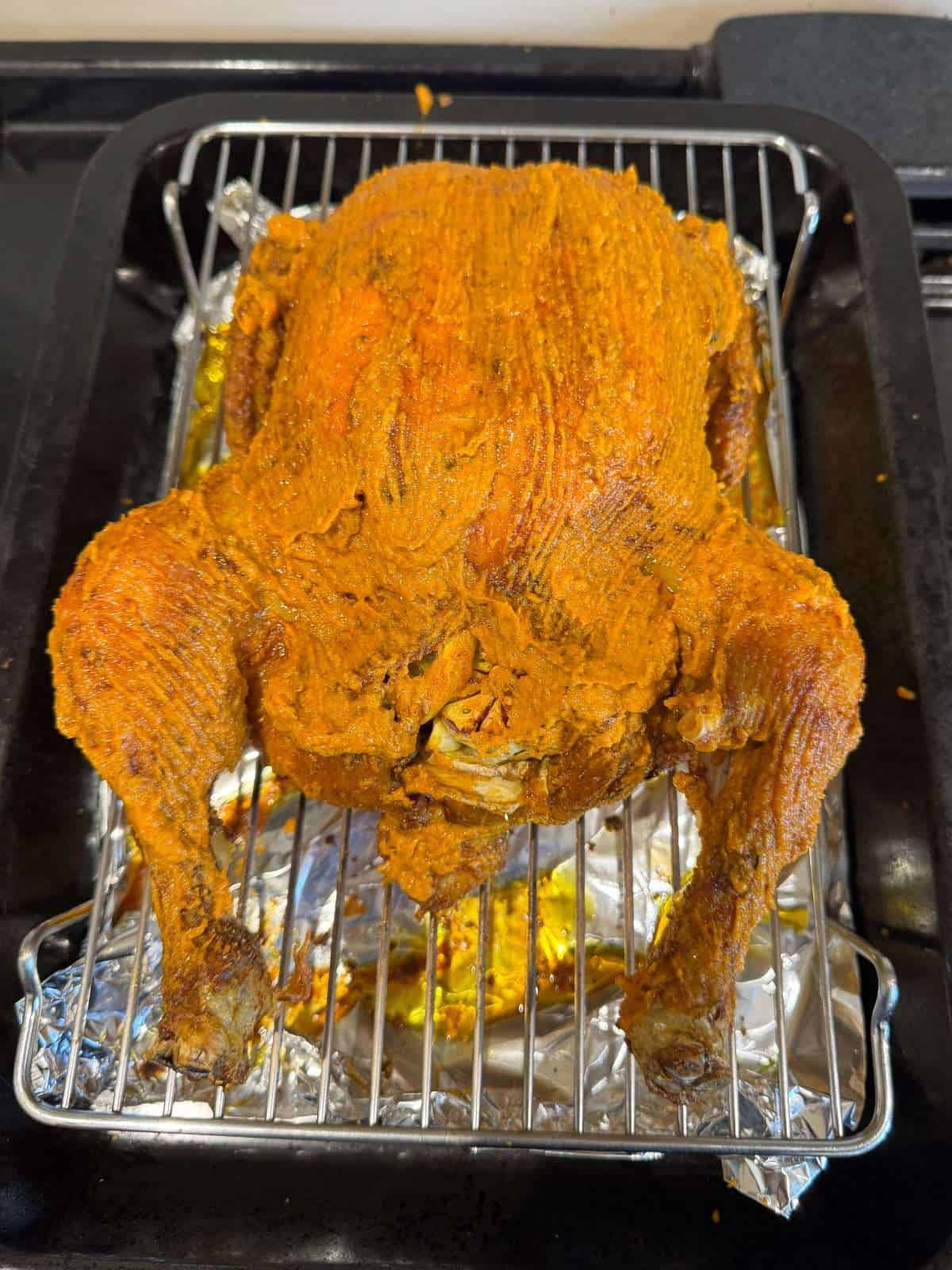 curry paste brushed onto roast chicken