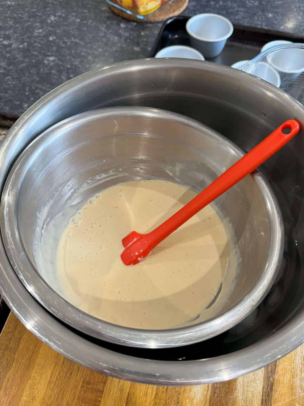 cooling panna cotta cream over ice bath