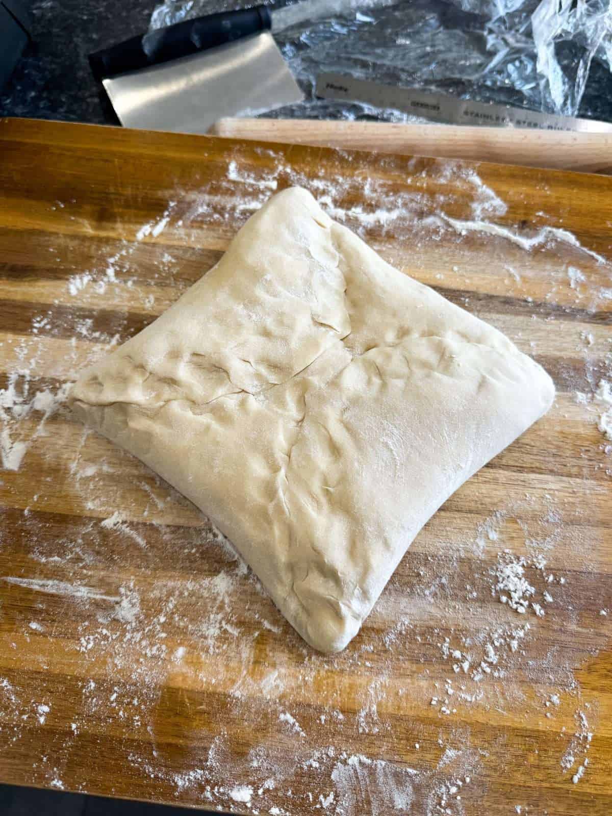 Danish dough wrapped around butter block