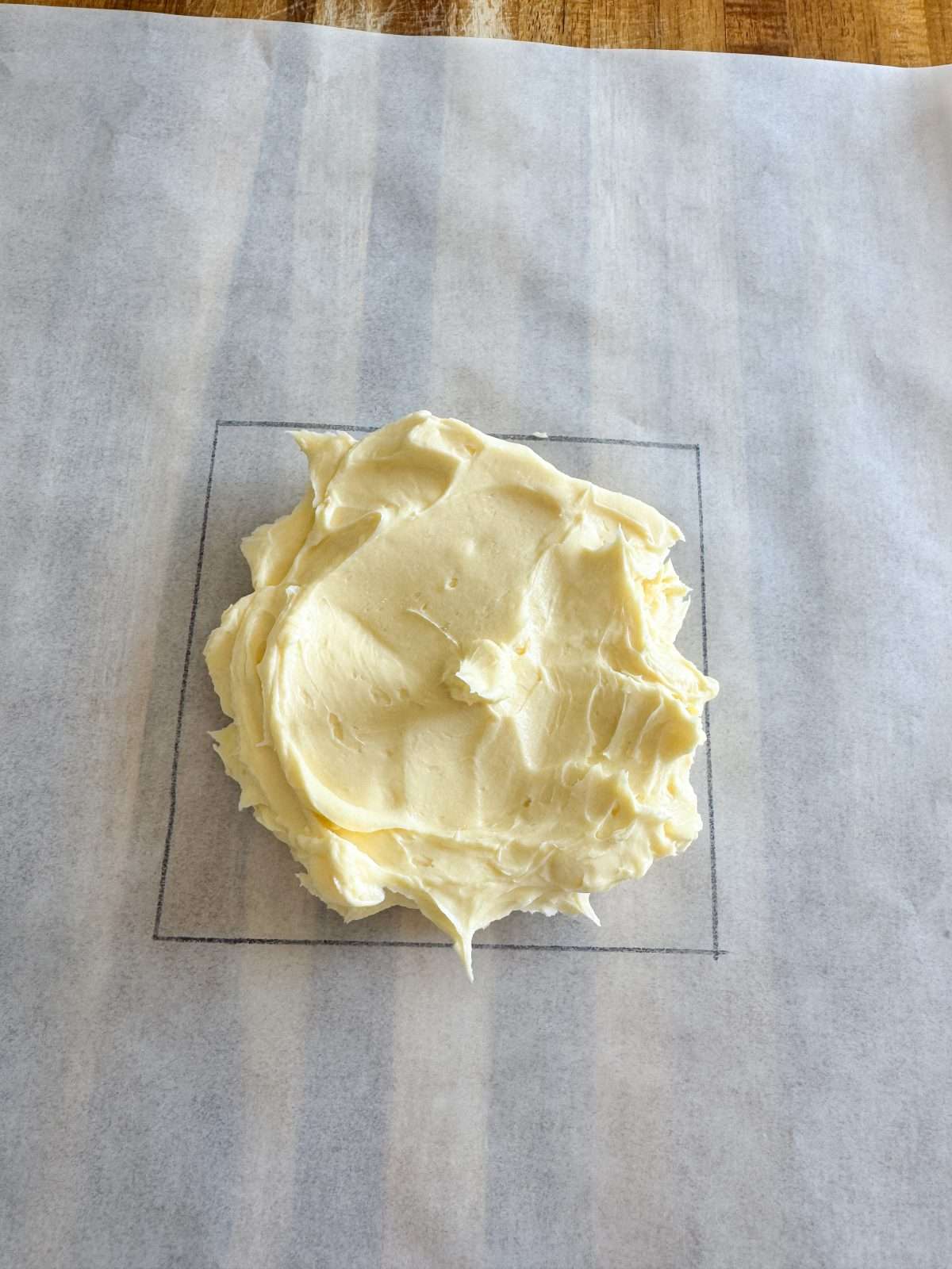 square of butter on parchment paper