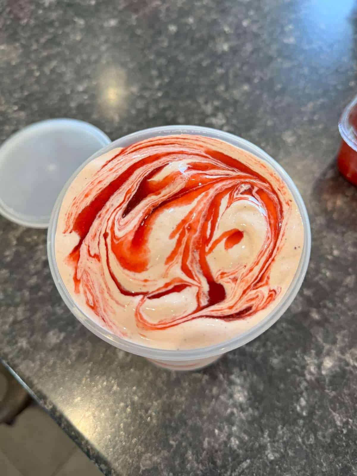 strawberry ice cream with strawberry ripple sauce