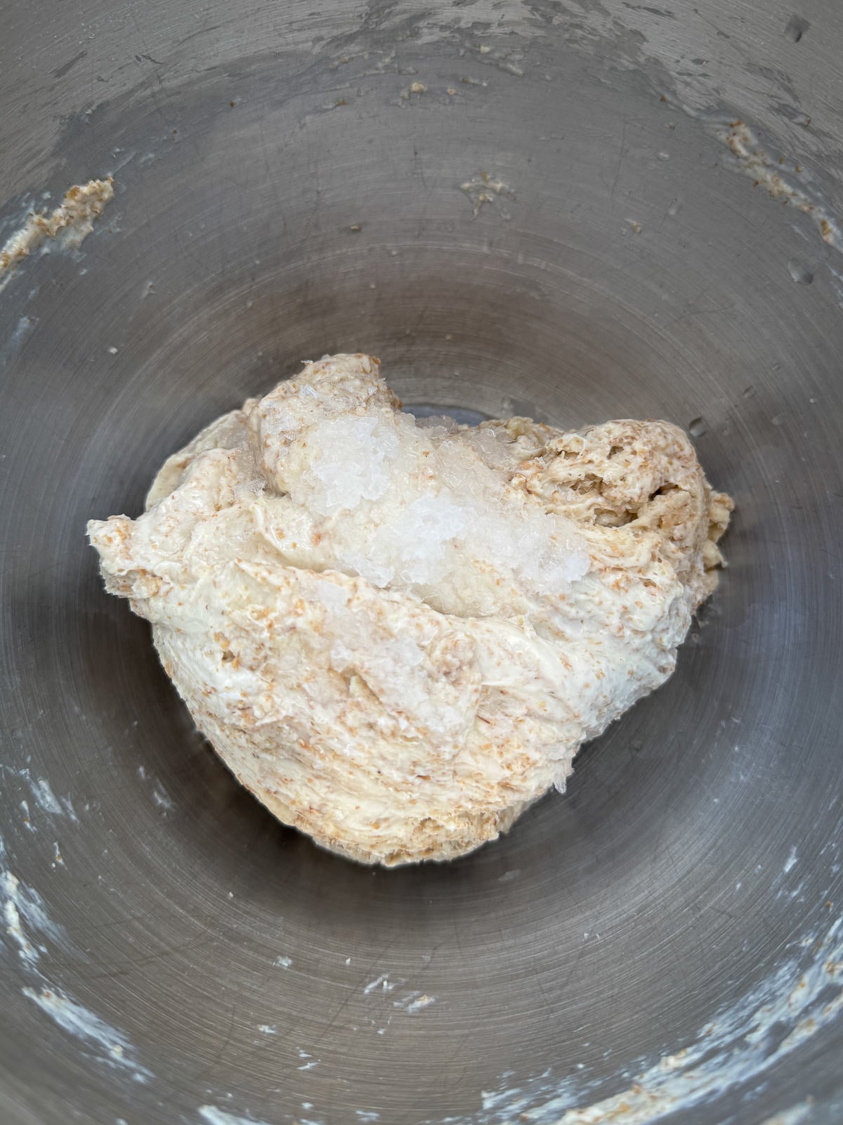 adding sea salt to dough