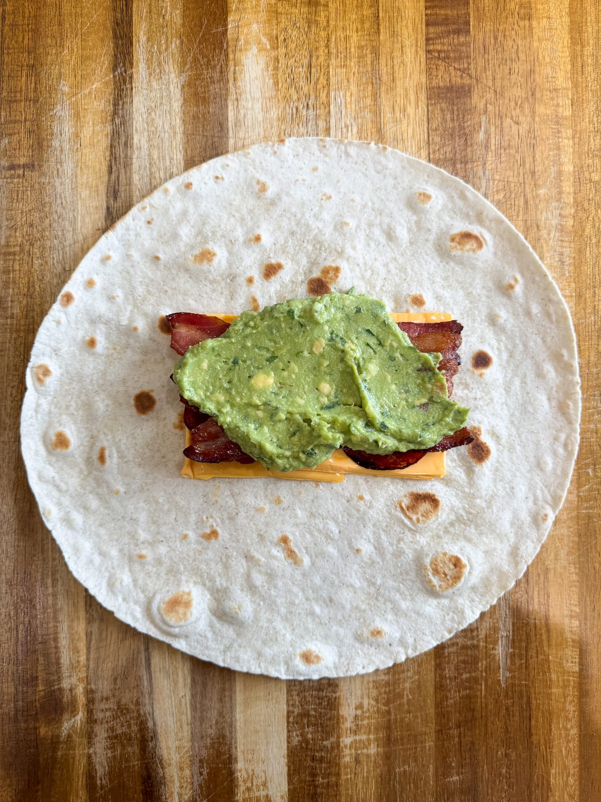 american cheese meat guacamole in tortilla
