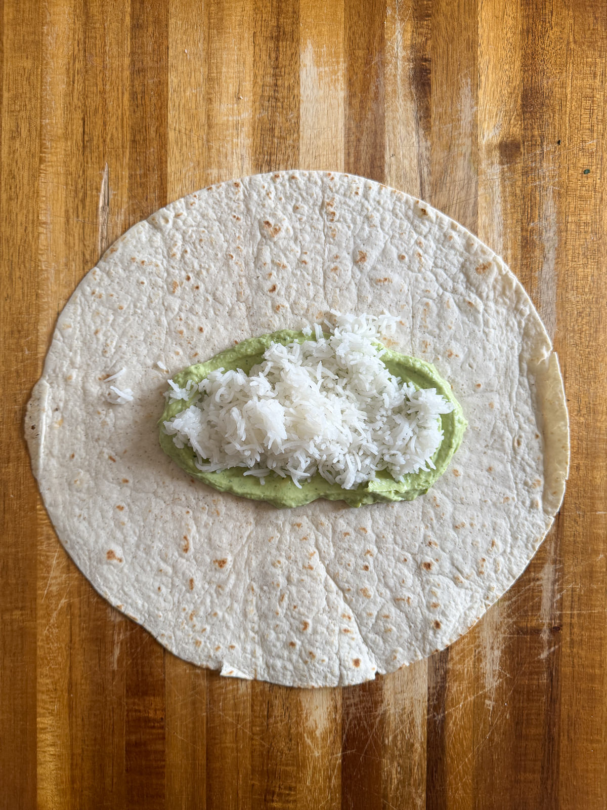 avocado crema & rice on tortilla
