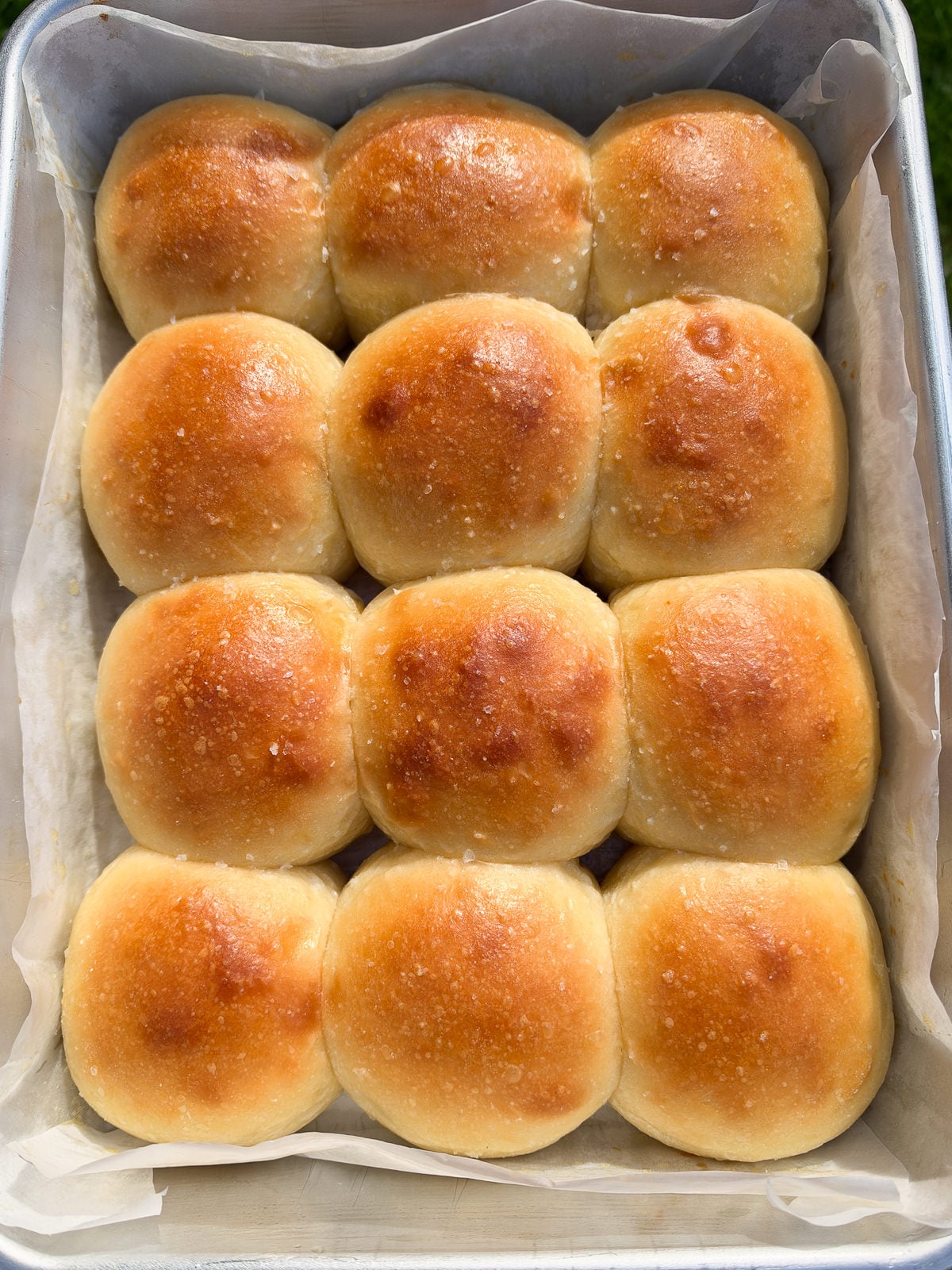 baked dinner rolls brushed with butter