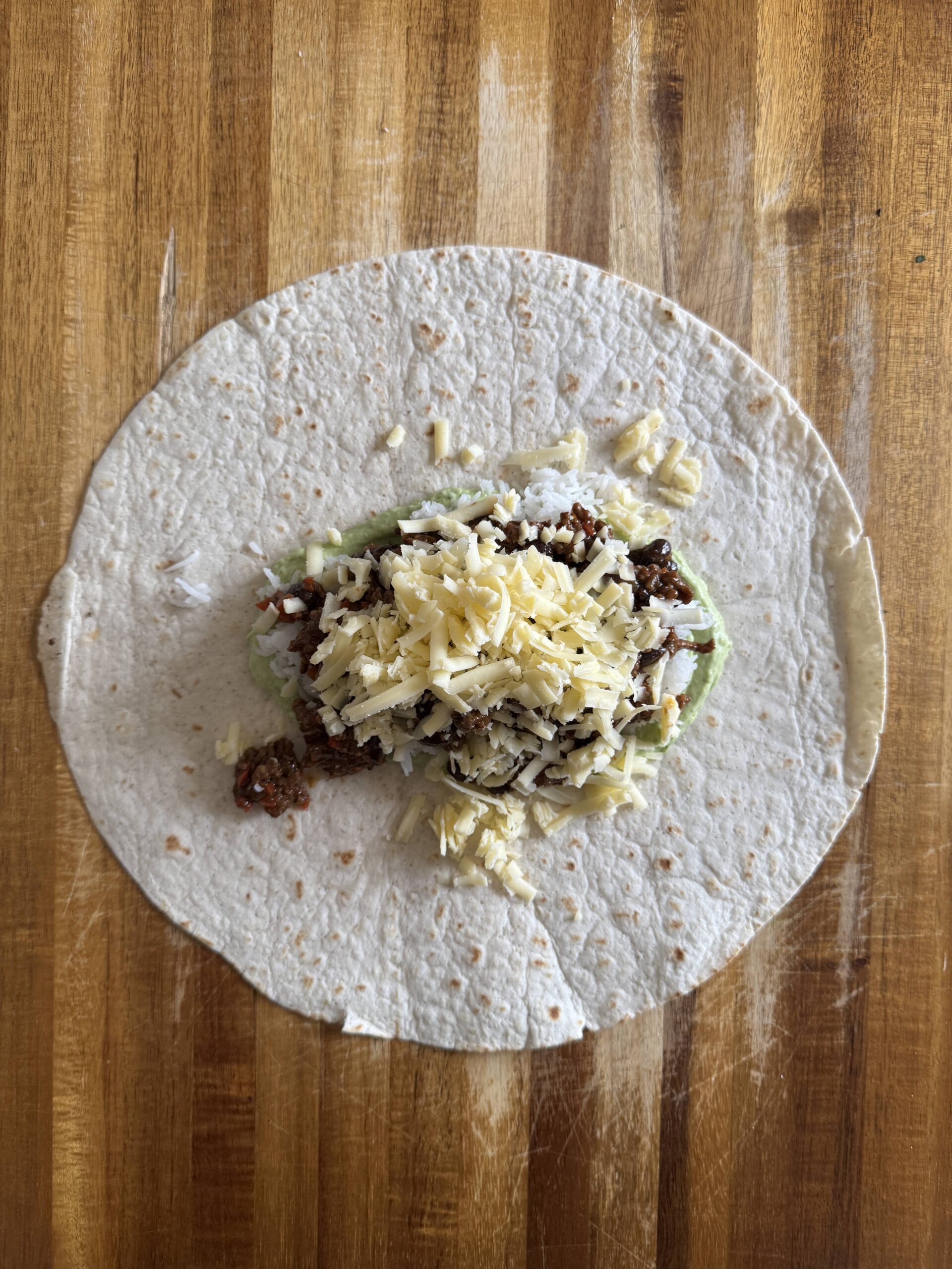 beef mince topped with cheese burrito filling