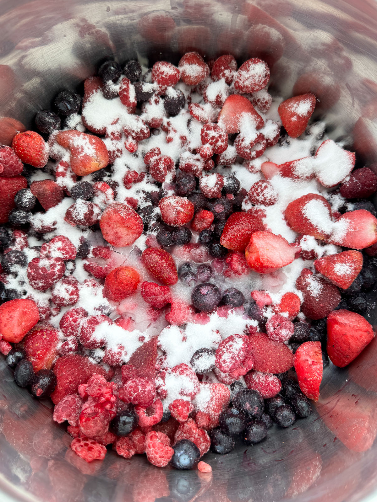 berries with sugar in a pan