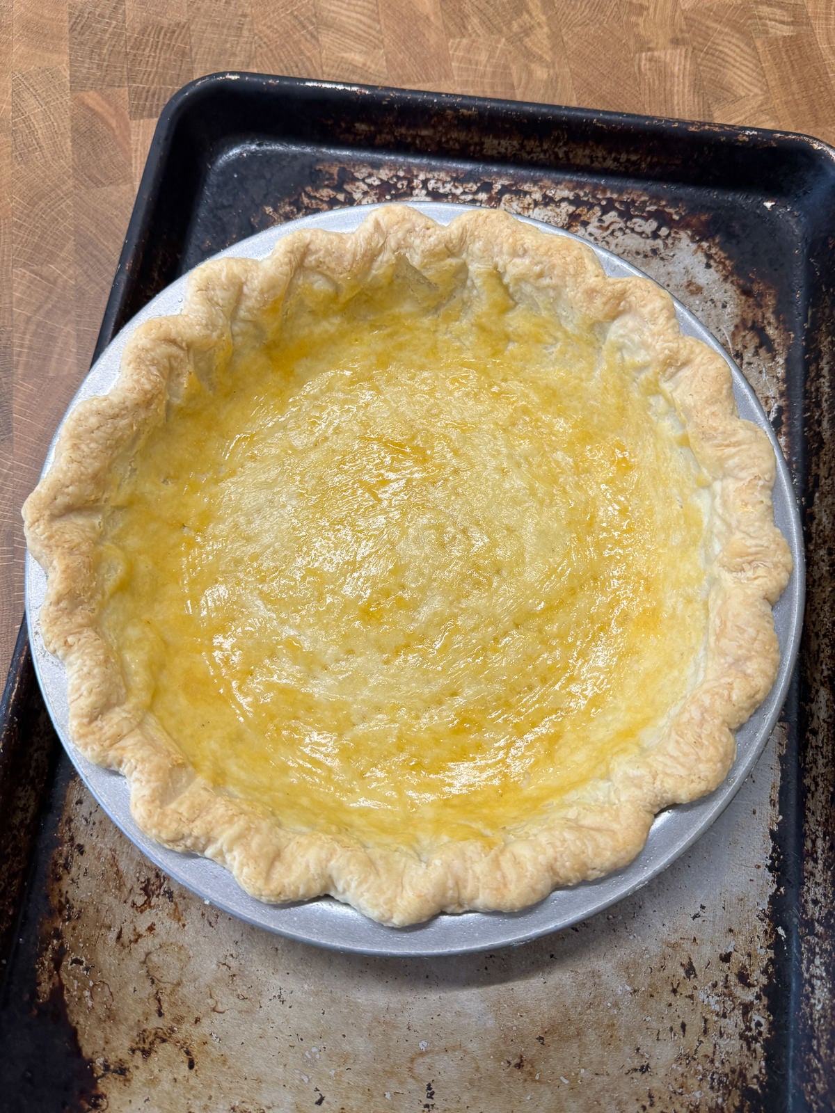 blind baked pie crust brushed with egg yolk