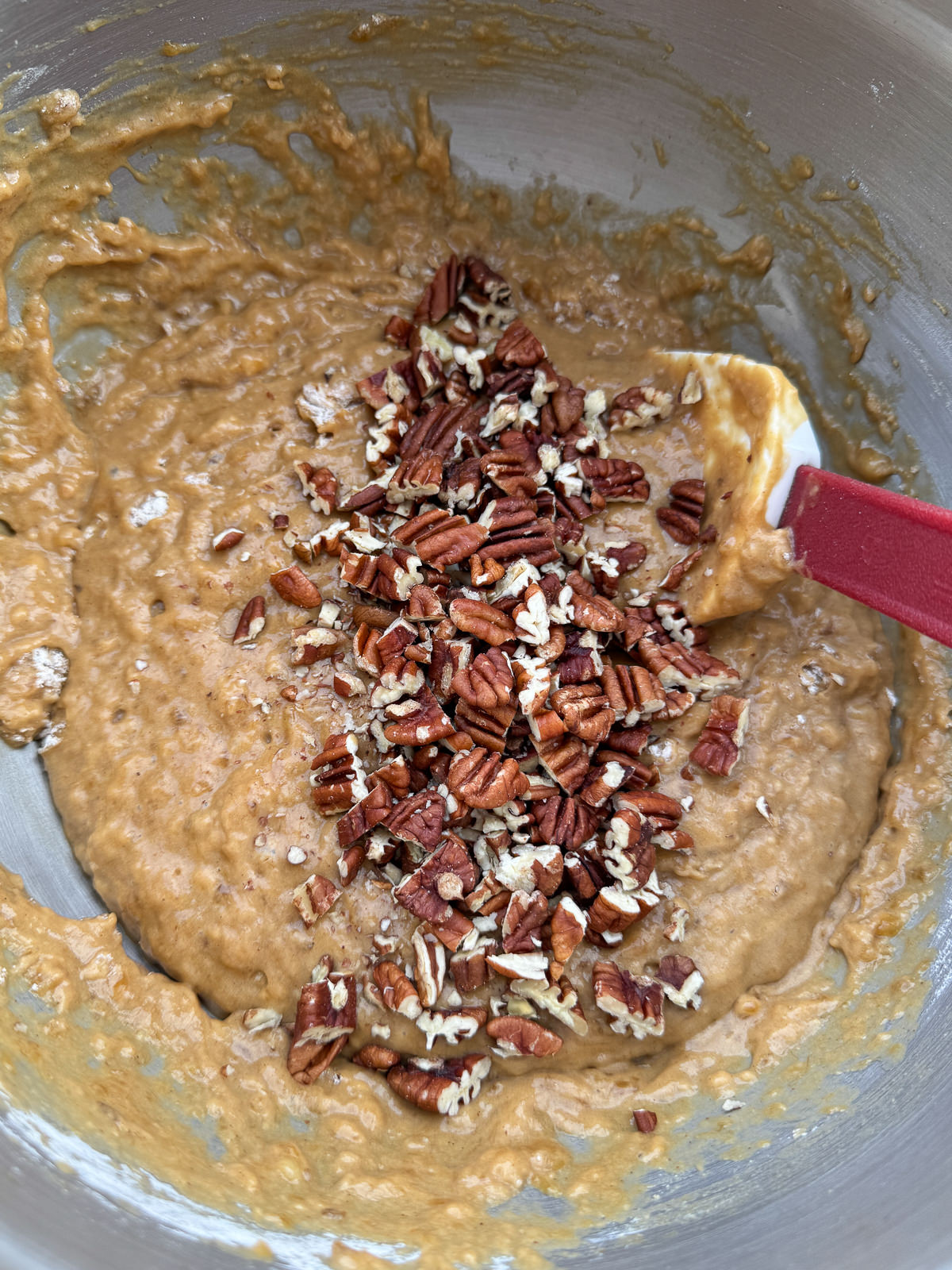 brown butter banana bread batter with chopped pecans