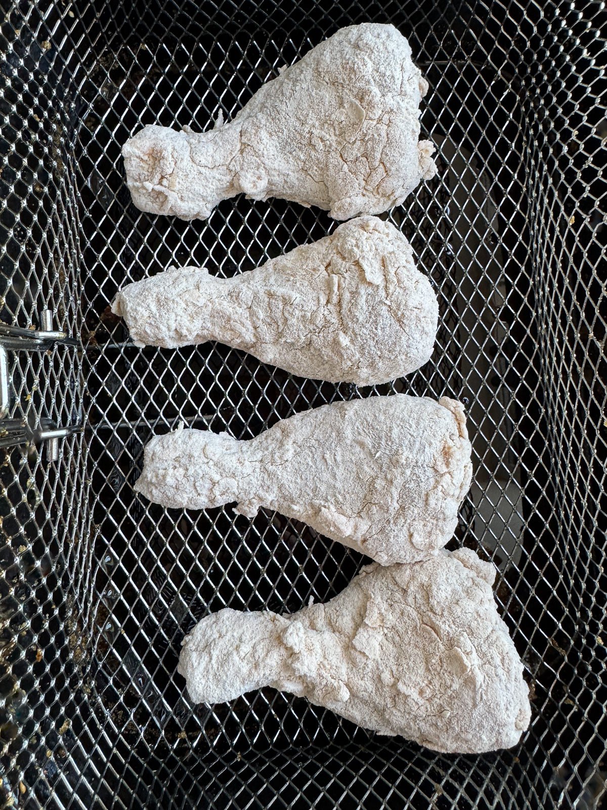 chicken drumsticks in deep fat fryer basket
