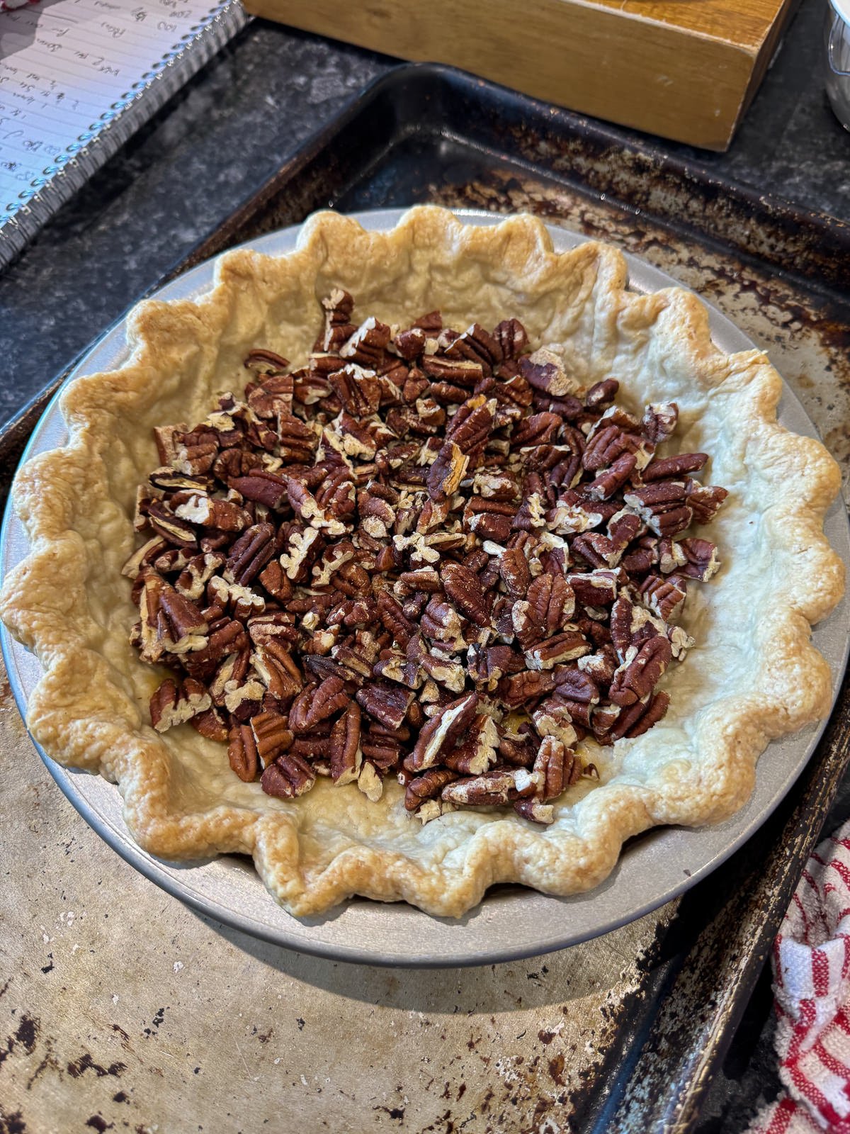 chopped pecans in par baked pie crust