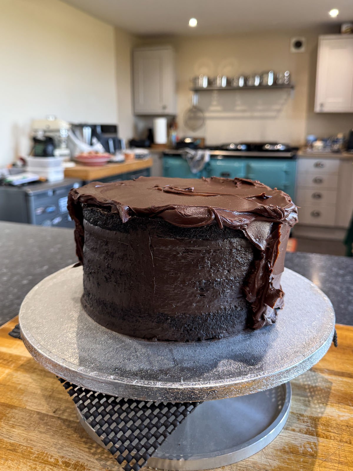 coating chocolate layer cake with ganache