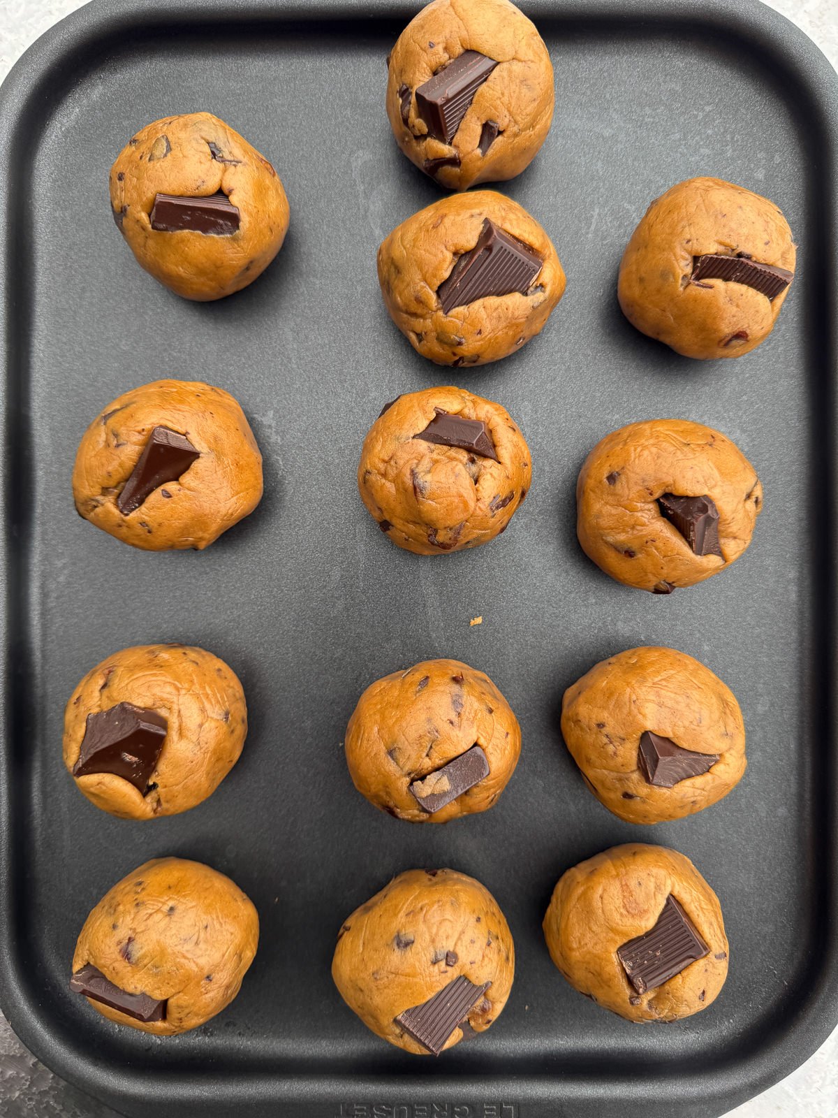 cookie dough balls with chocolate chunks on top
