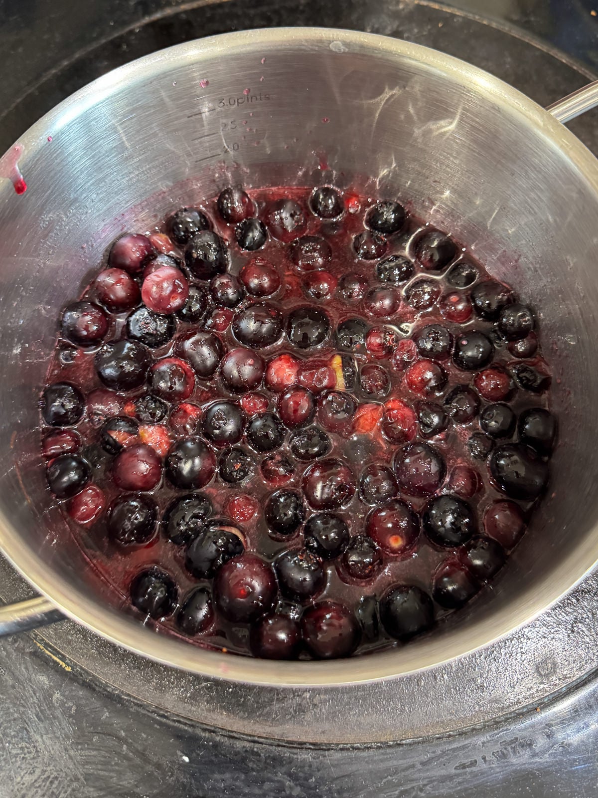 cooking berry compote on stove