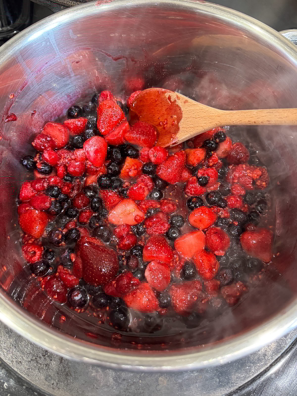 cooking compote on the stove to thicken