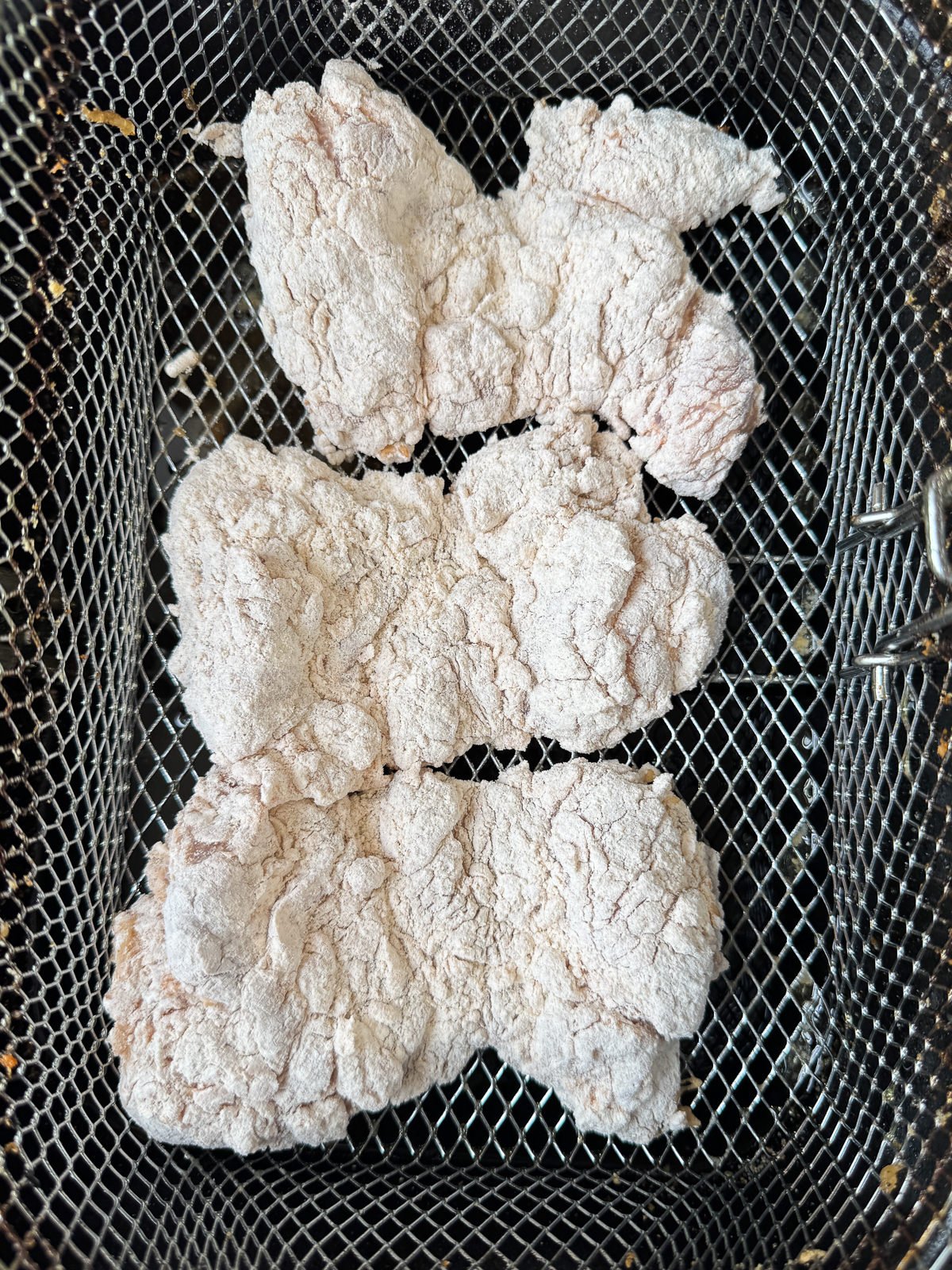 dredged chicken in deep fat fryer