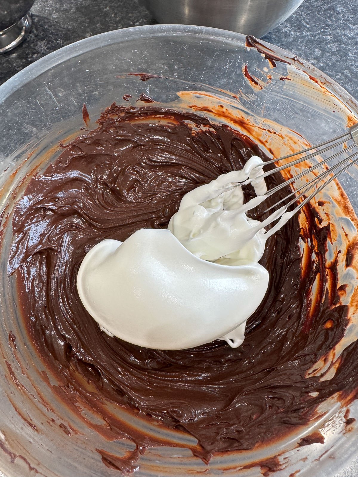 folding French meringue into chocolate custard