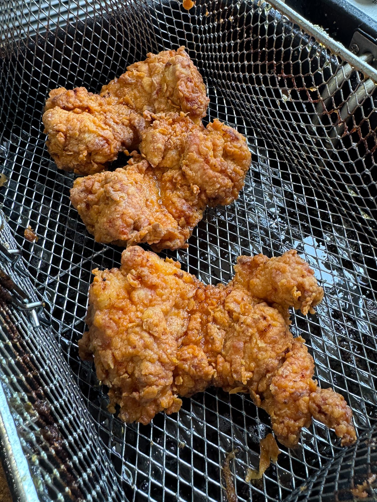 fried chicken in fryer basket