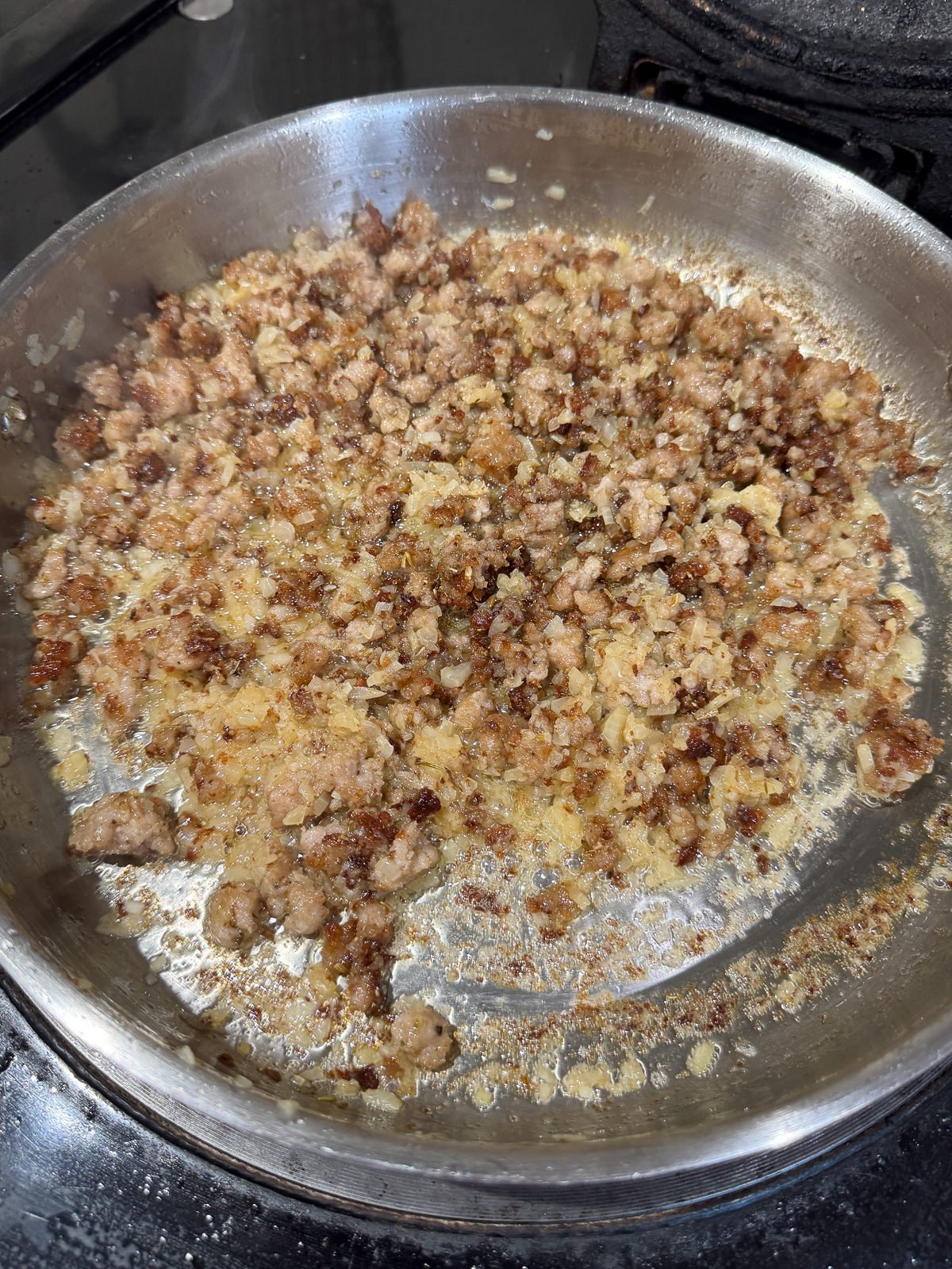 fried sausage meat with onions & garlic deglazed with white wine